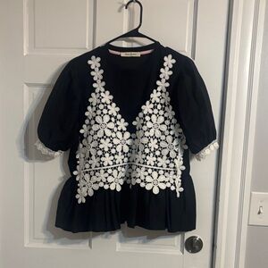 Elegant Black Blouse with White Floral Accents